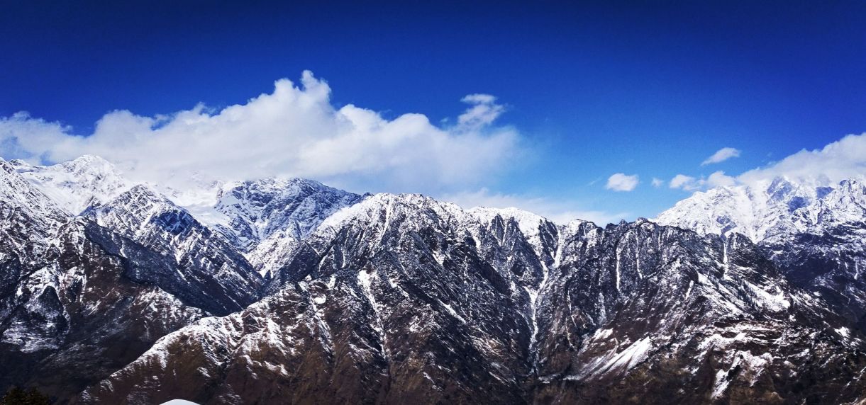 Snowy ridge under a deep blue Himalayan sky