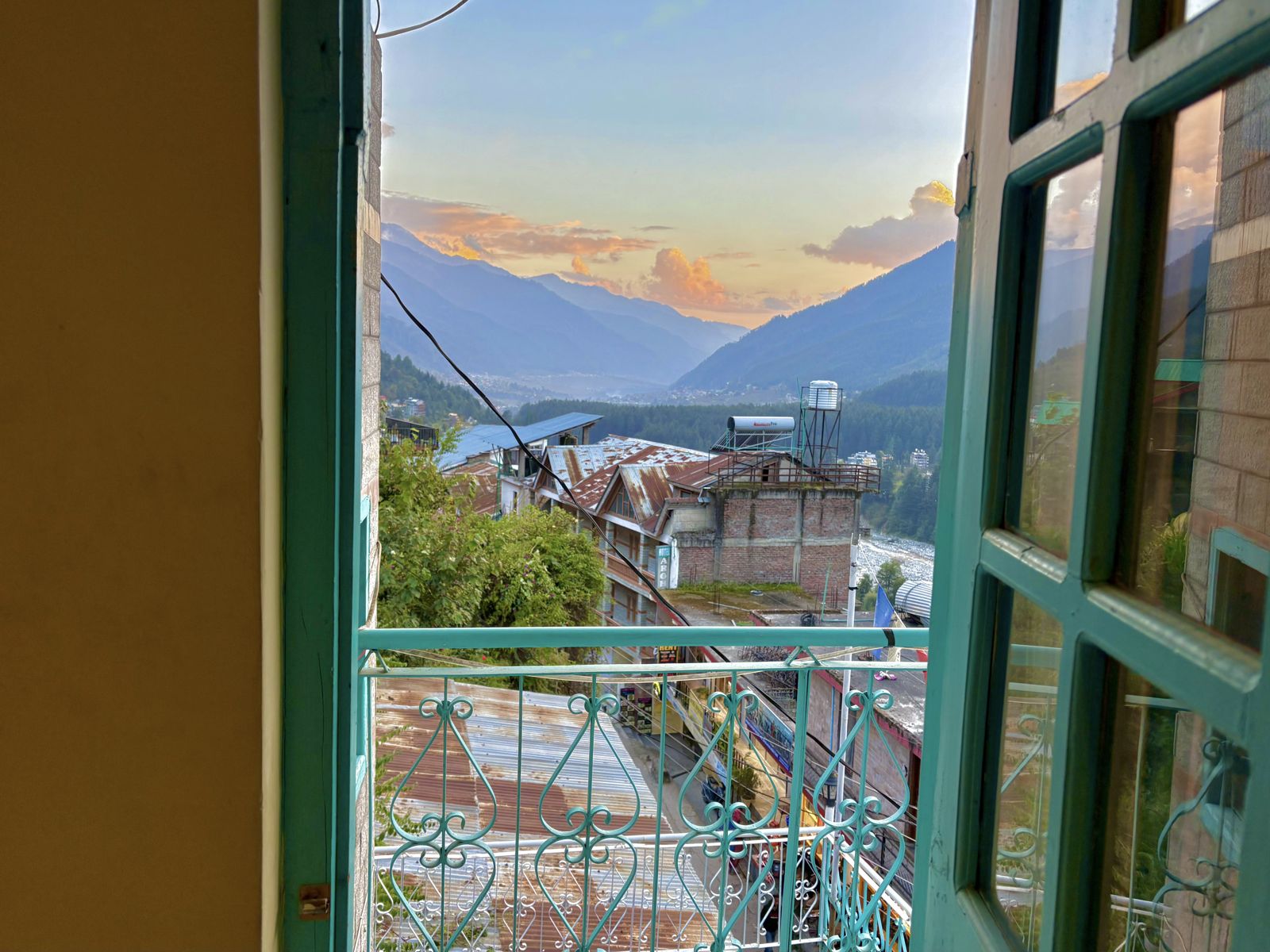 Sunset over the valley through a teal window at Misfits